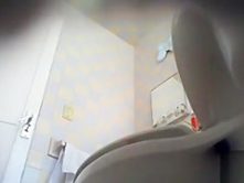 Cute maid piddles on a hidden camera