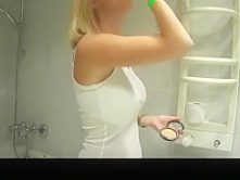 Girl dancing in the bathroom in just her bra