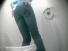 Hot legs and ass on babe urinating in bathroom