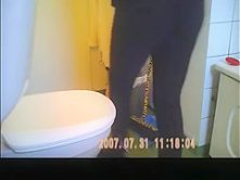 Long hair brunette peeing in bathroom