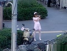 Naughty Asian girl is pissing in public part2