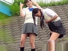 Outside pissing competition with two young Japanese pupils