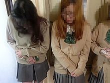 School Girls pissing while waiting in line for the bathroom.