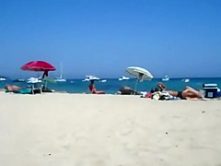 Secret view as she rubs pussy on a beach