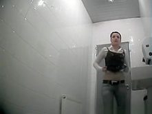 Sexy girl peeing at bathroom