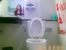Sexy hot brunette spied in bathroom peeing