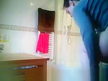 Teen changing tampon in bathroom
