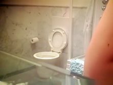 Teen spied peeing and dressing