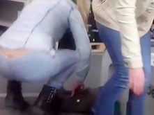 Woman squats exposing thong