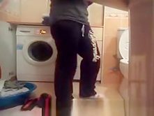 Woman undressing in bathroom