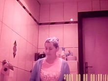 Woman using her toilet to take a piss