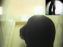 Blonde woman pissing in toilet