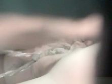 Chubby woman with trimmed pussy pissing