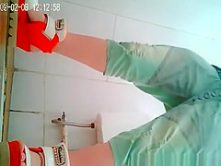 Cute asian spied in public toilet pissing