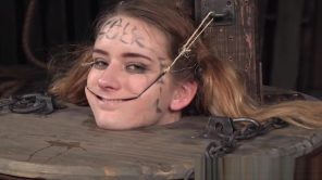 Femdom rubs pussyjuice on suspended teen