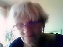 Granny has cybersex with a stranger on cam and flashes her big boobs