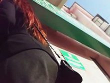 Hot redhead spied on by an up skirt perv