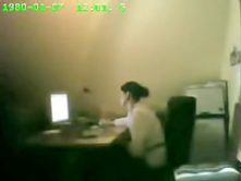 Raunchy security cam masturbation from the office cutie