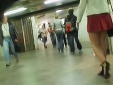 Redhead cutie followed around by an upskirt cam