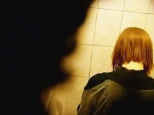 Skinny redhead with short hair, shows ass and takes a piss on a toilet