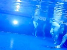 Voyeur cam vid of a bunch of naked people in pool