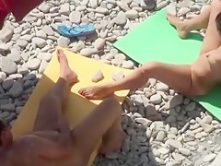 Voyeur tapes a nudist couple having oral sex at the beach