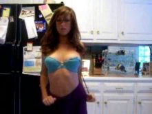 Young busty chick strips in the kitchen, where she belongs