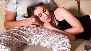 Stepdaughter and stepdad watching a movie on the couch